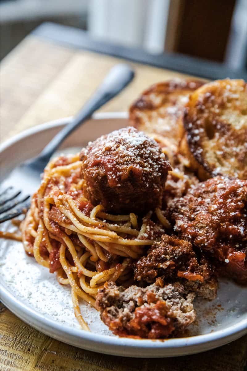 Delicious homemade spaghetti with savory meatballs and rich tomato sauce. Perfect comfort food for f.