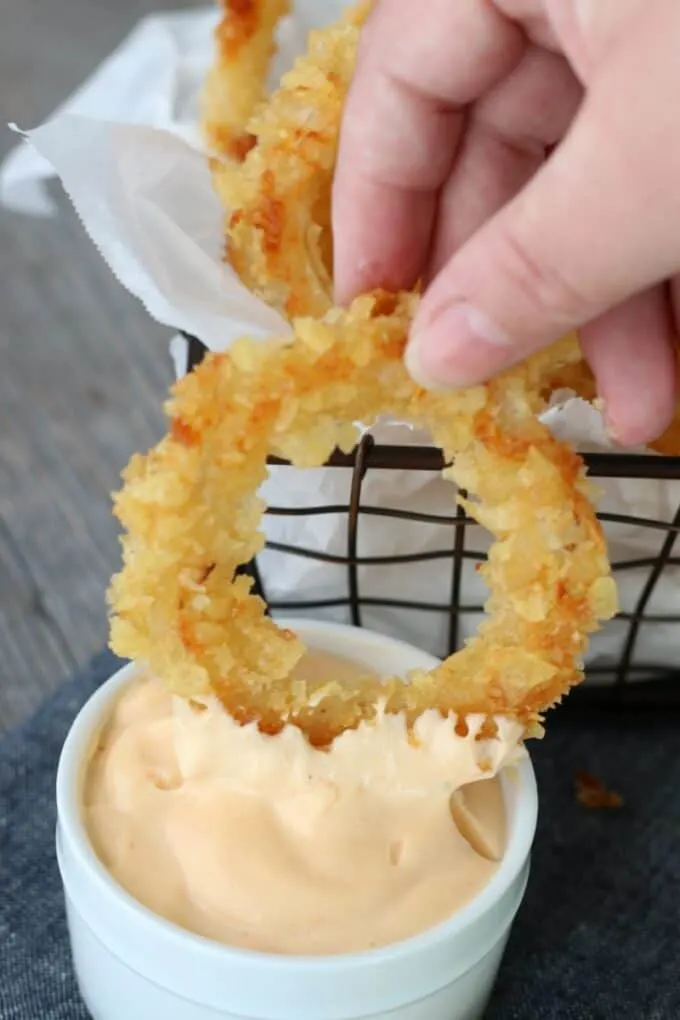 Onion ring dipped in aioli