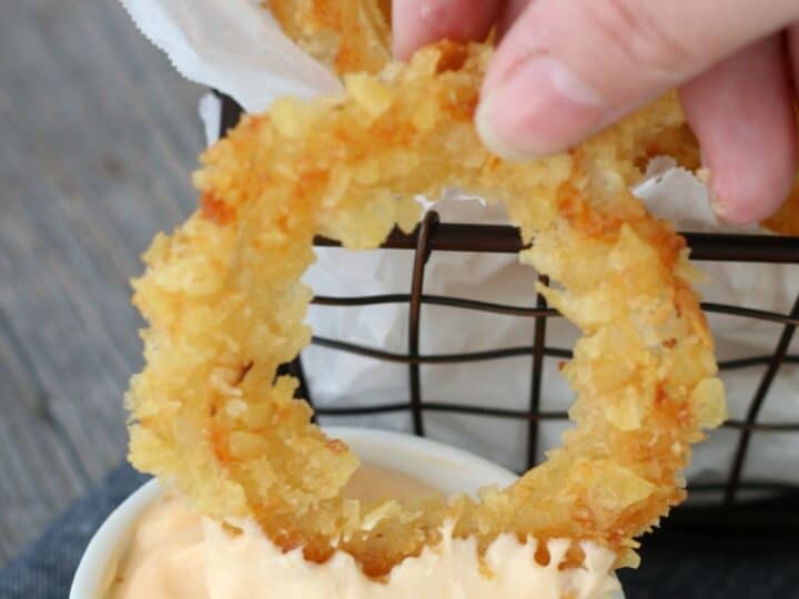 Onion ring dipped in aioli