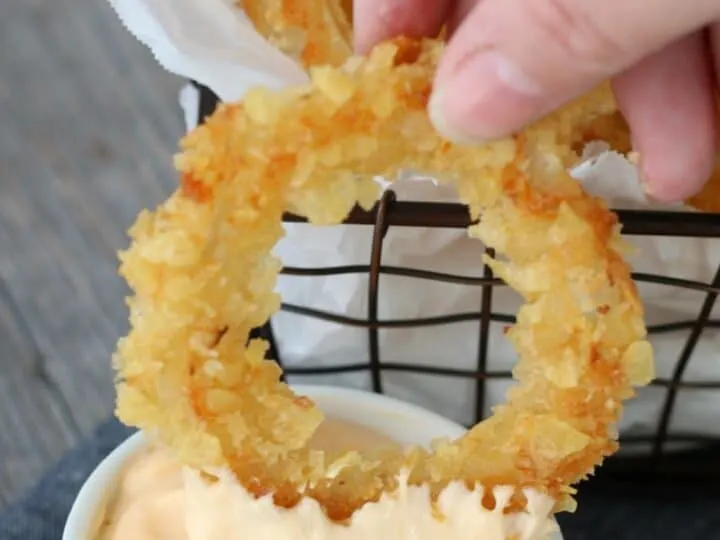 Onion ring dipped in aioli