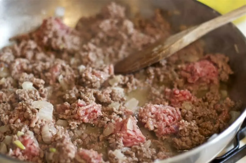 Ground Beef Browning in Stainless Steel Pan on Stovetop