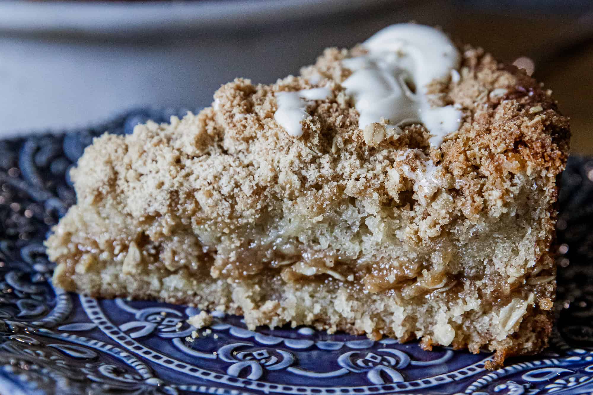 Delicious banana crumb cake with a crunchy topping and creamy filling, perfect for dessert or breakf.