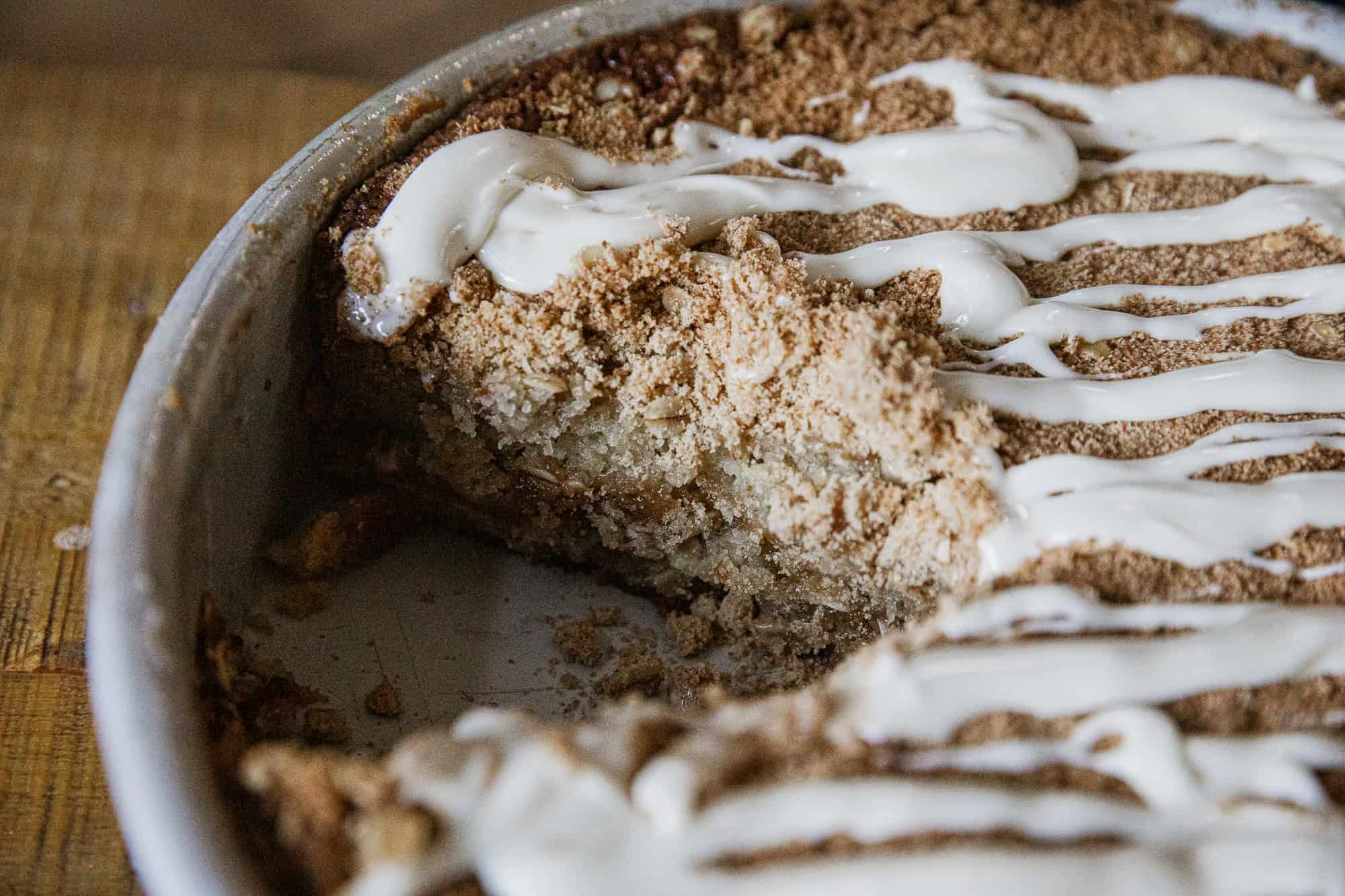 Delicious banana crumb cake with a crunchy topping and creamy glaze, perfect for breakfast or desser.