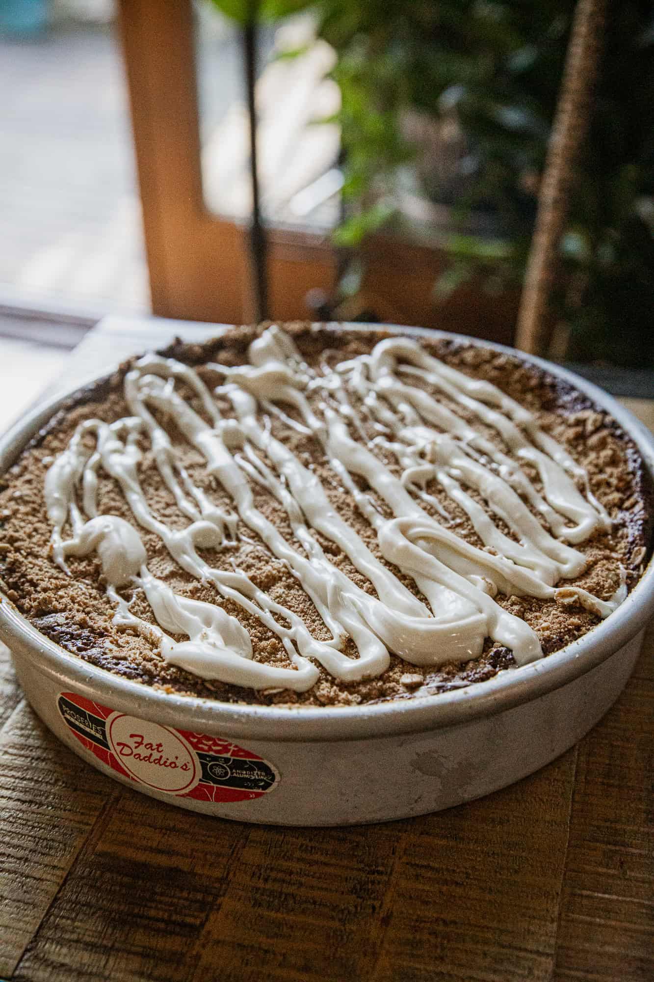 Delicious banana crumb cake topped with creamy drizzle, perfect for breakfast or dessert.