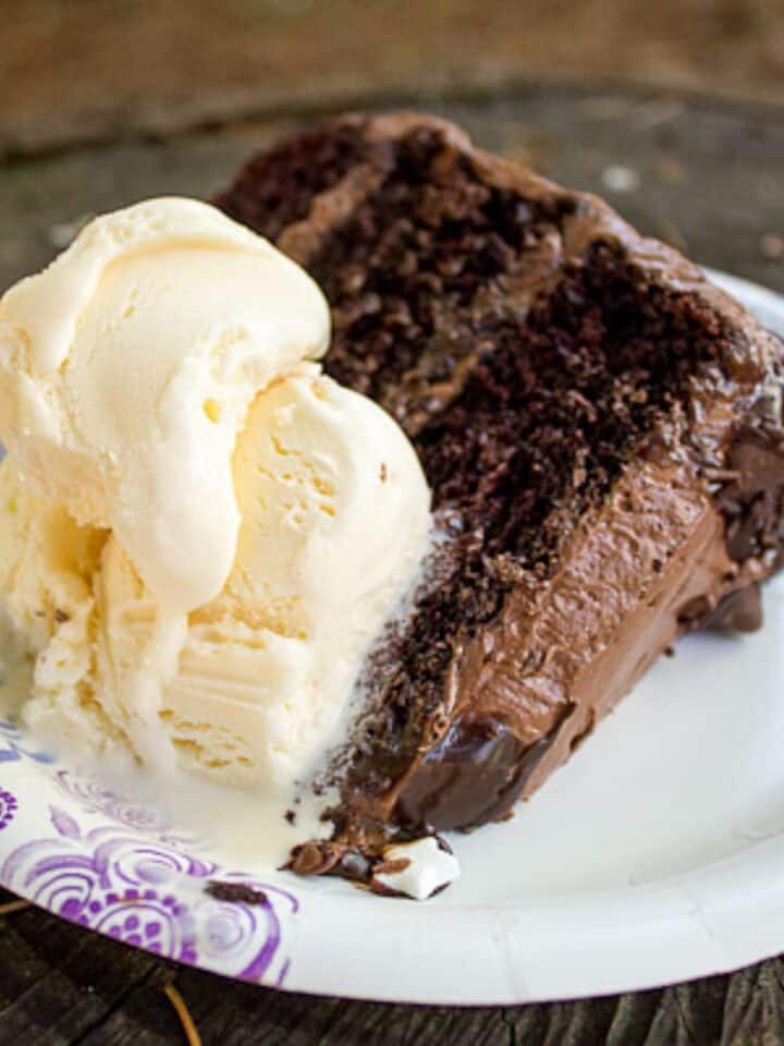 Chocolate quadruple birthday cake with ice cream.