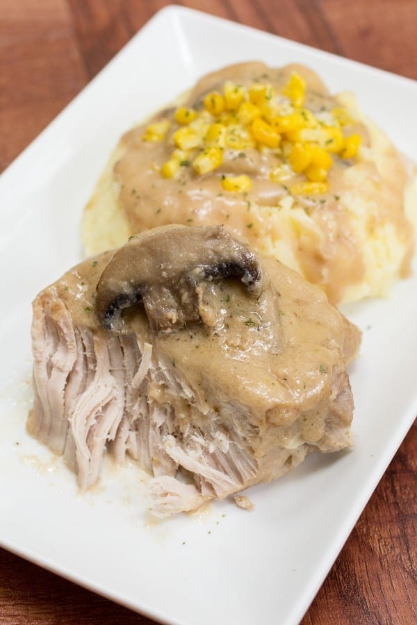 These made-from-scratch slow cooker pork chops with creamy mushroom gravy are so tender, moist, and delicious!