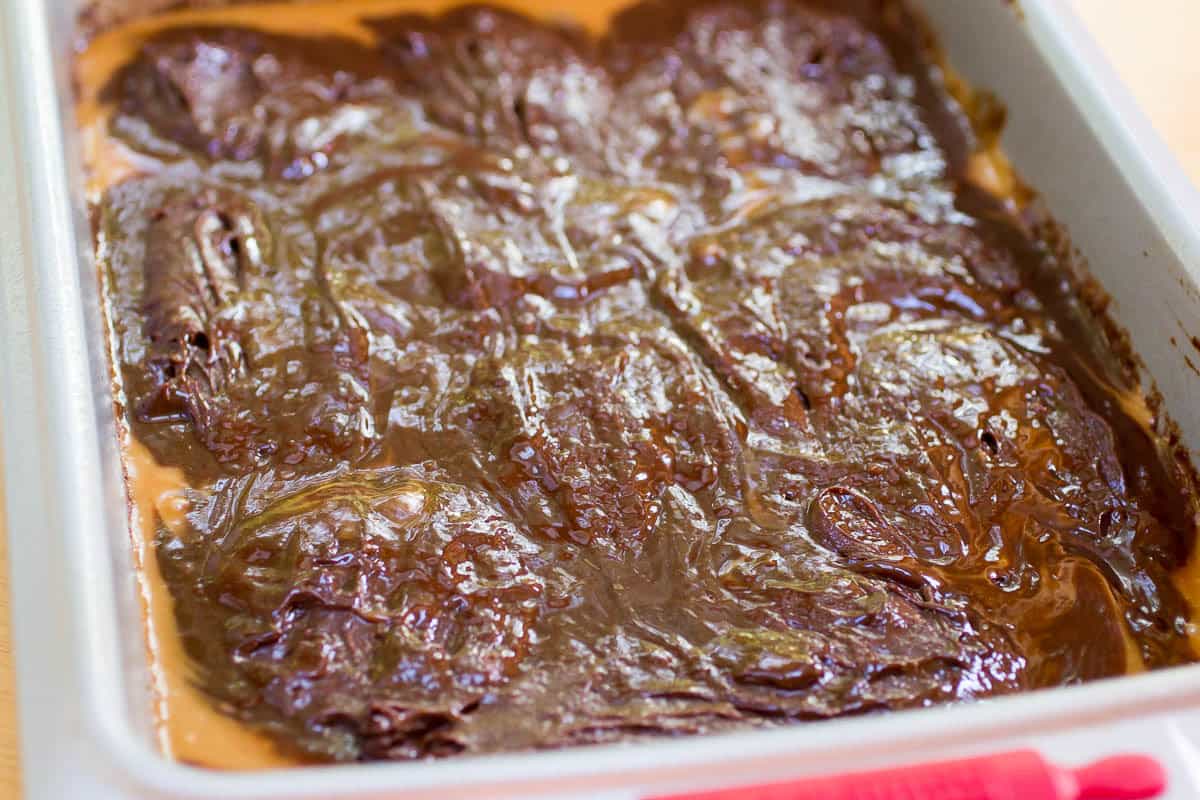 Caramel Filled Brownies are made from scratch, require no mixer, and are the perfect balance between a fudgey and cakey brownie.