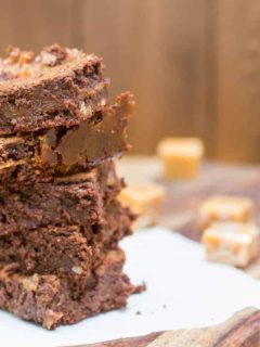 Caramel Filled Brownies are made from scratch, require no mixer, and are the perfect balance between a fudgey and cakey brownie.