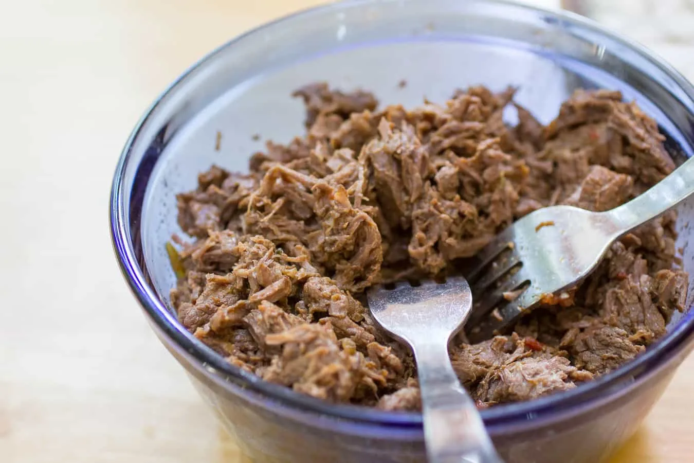 Shred the beef with a couple of forks.