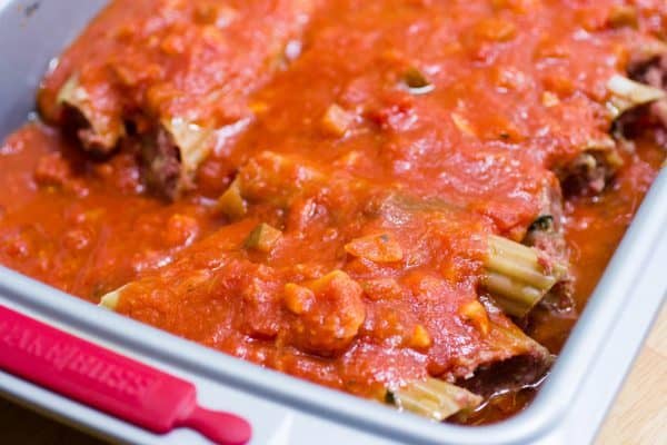 Top the manicotti with the rest of the sauce.