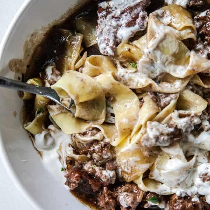 Close-up of creamy ground beef stroganoff with noodles and mushrooms.