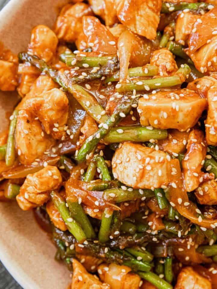 Delicious Gochujang Chicken Stir-Fry with green beans and sesame seeds.