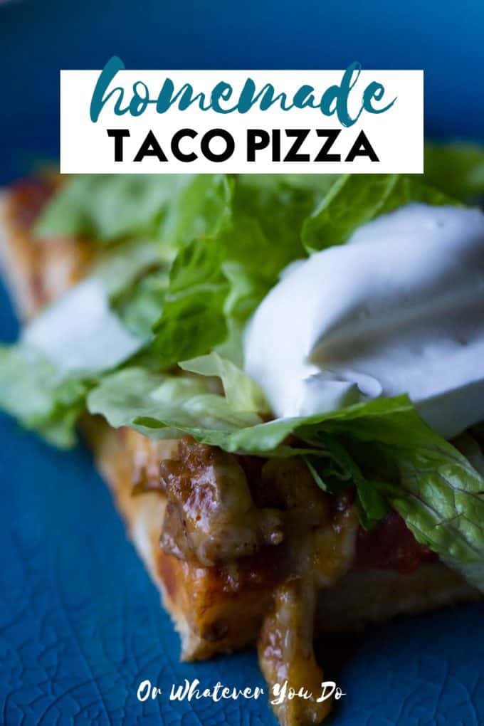 Homemade Taco Pizza on a blue plate with lettuce and sour cream on top