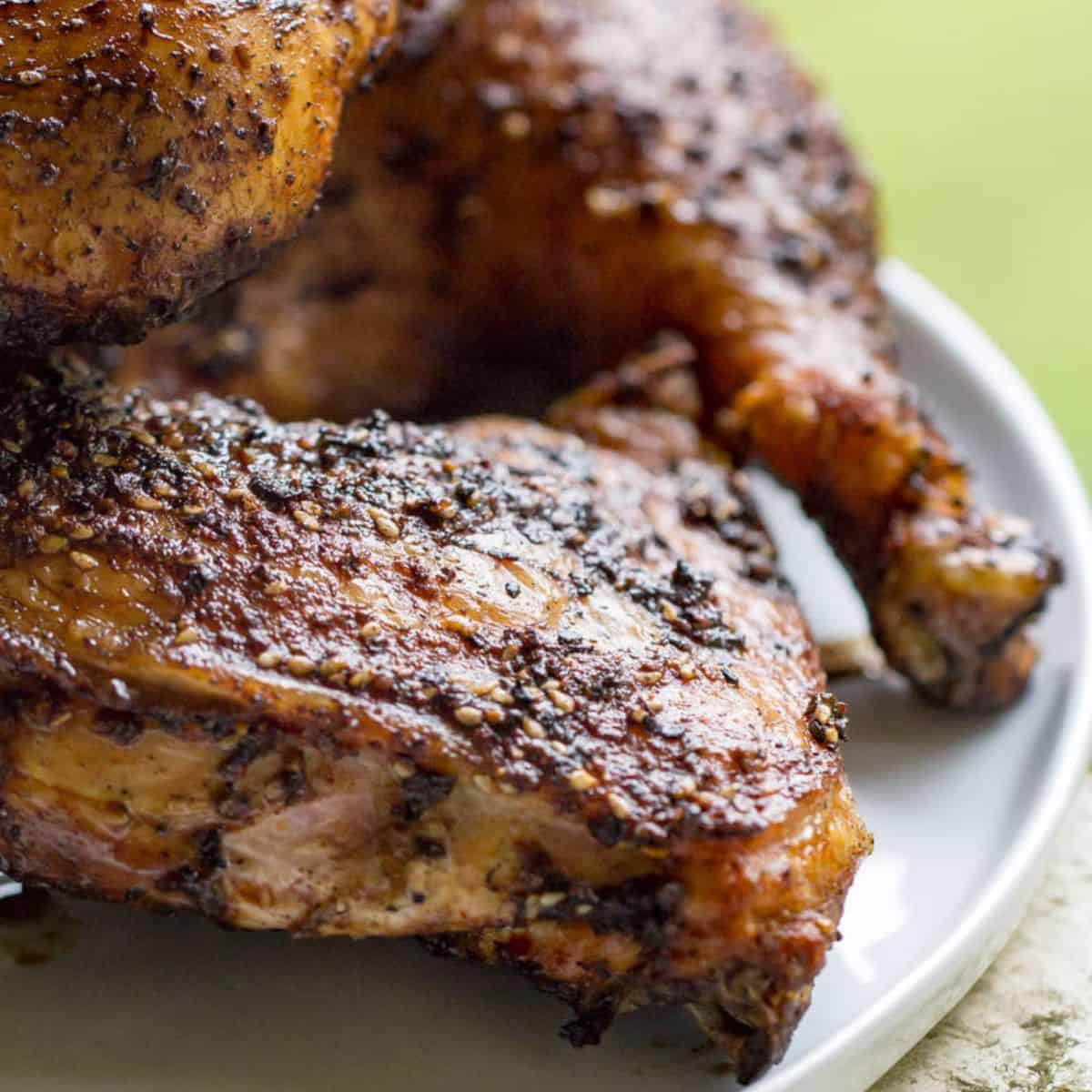 Delicious Traeger grilled chicken leg quarters with crispy skin and smoky flavor. Perfect for outdoo.