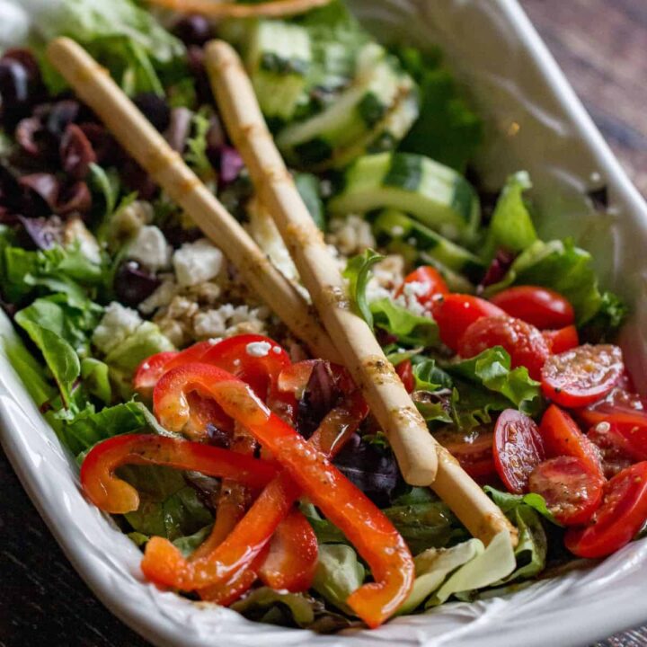 Healthy Greek salad with tomatoes, cucumbers, peppers, and feta cheese.