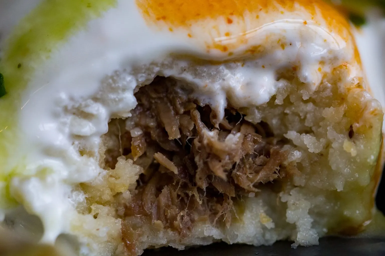 Tamales filled with seasoned shredded beef.