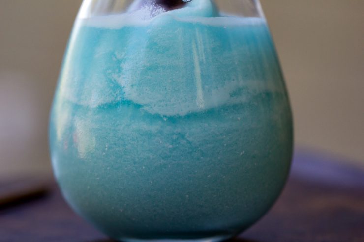 Blue Hawaiian Colada closeup, showing layers of the drink