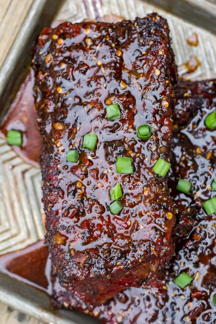 Spicy Asian Pork Ribs on a gray baking sheet