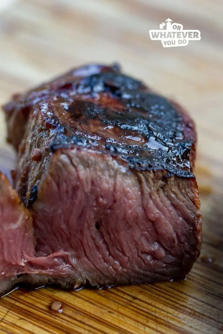 Flat Iron Steak sliced in half cooked medium rare