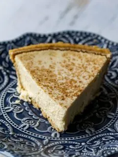 This homemade eggnog cheesecake is the perfect mix of sweet and rich, and is topped with a sprinkle of cinnamon to really bring out the flavor of the eggnog!