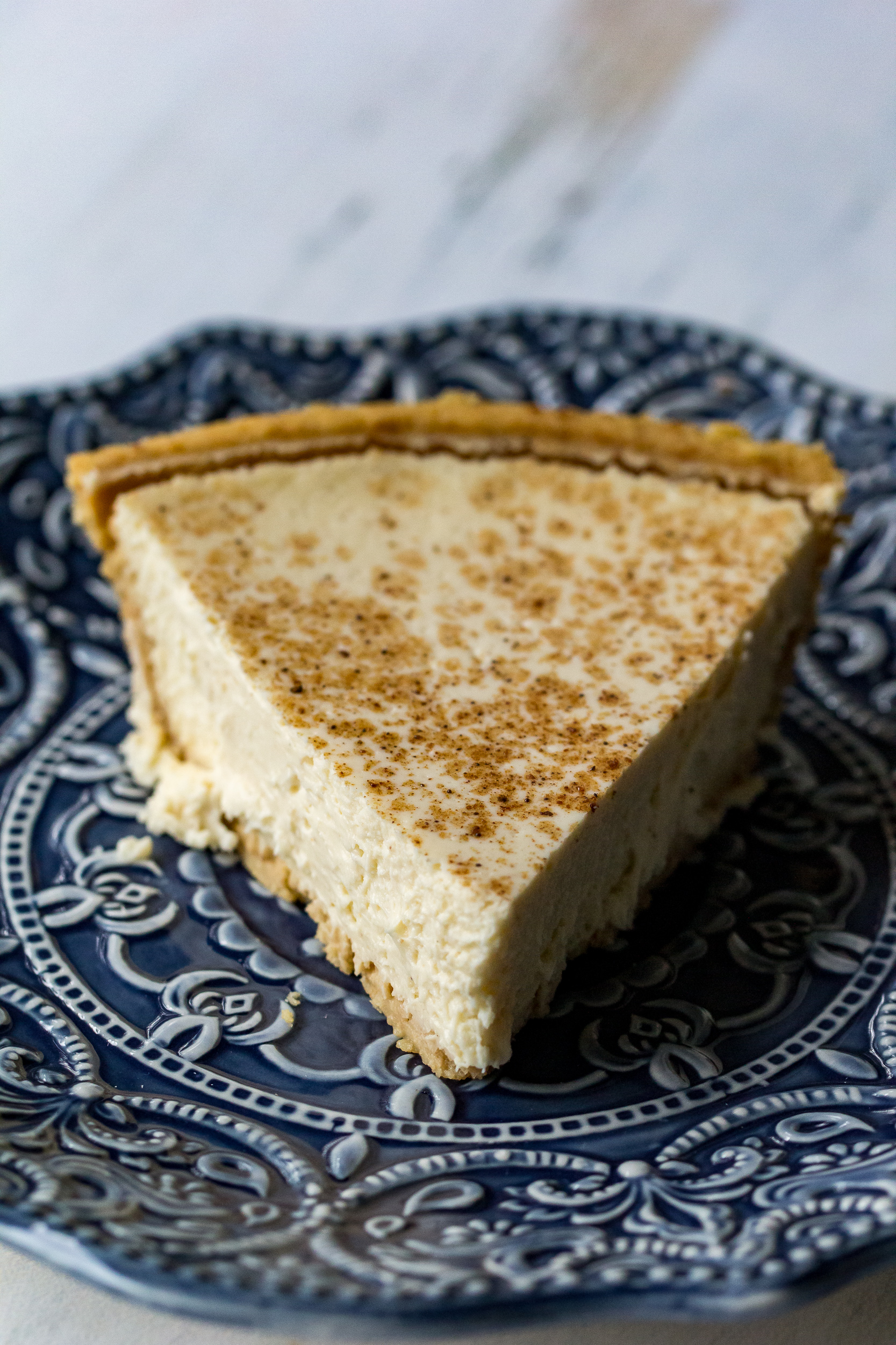 This homemade eggnog cheesecake is the perfect mix of sweet and rich, and is topped with a sprinkle of cinnamon to really bring out the flavor of the eggnog!