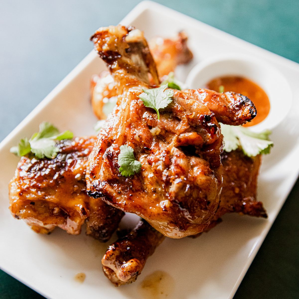 Grilled Butterflied Chicken Legs with Spicy Chili Garlic Glaze