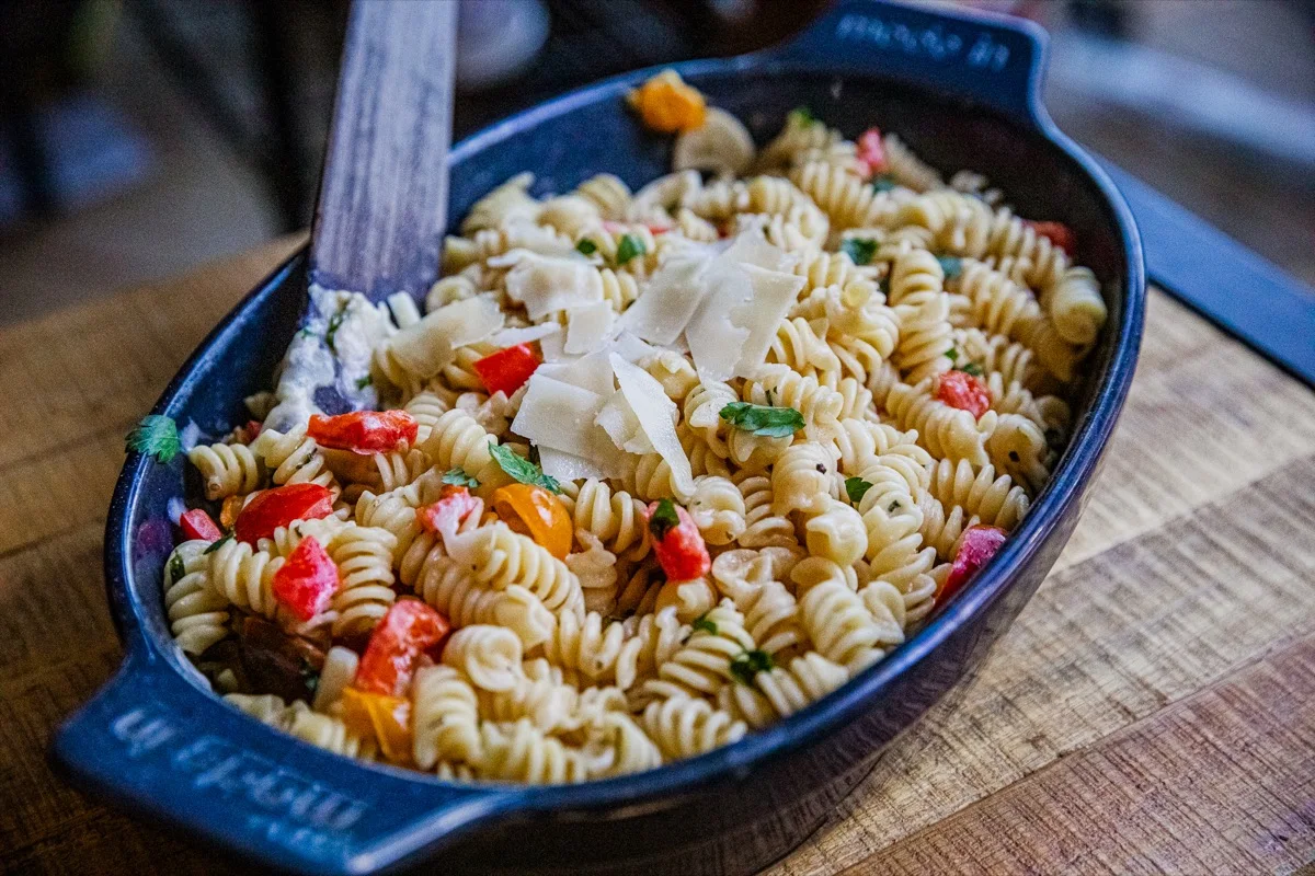 Creamy Boursin cheese pasta served in a skillet with fresh herbs.