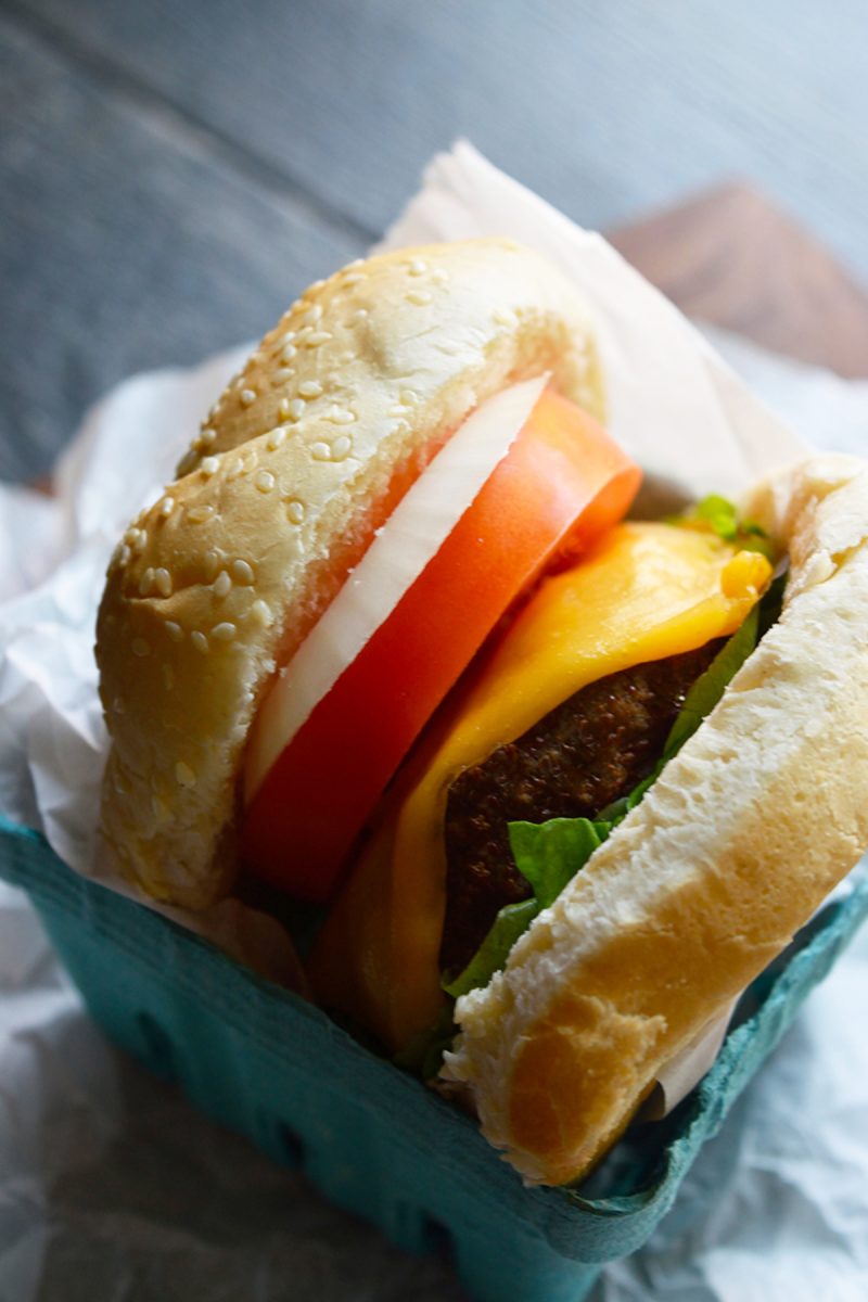 Air fryer turkey burger on top of a piece of paper, served in a basket.