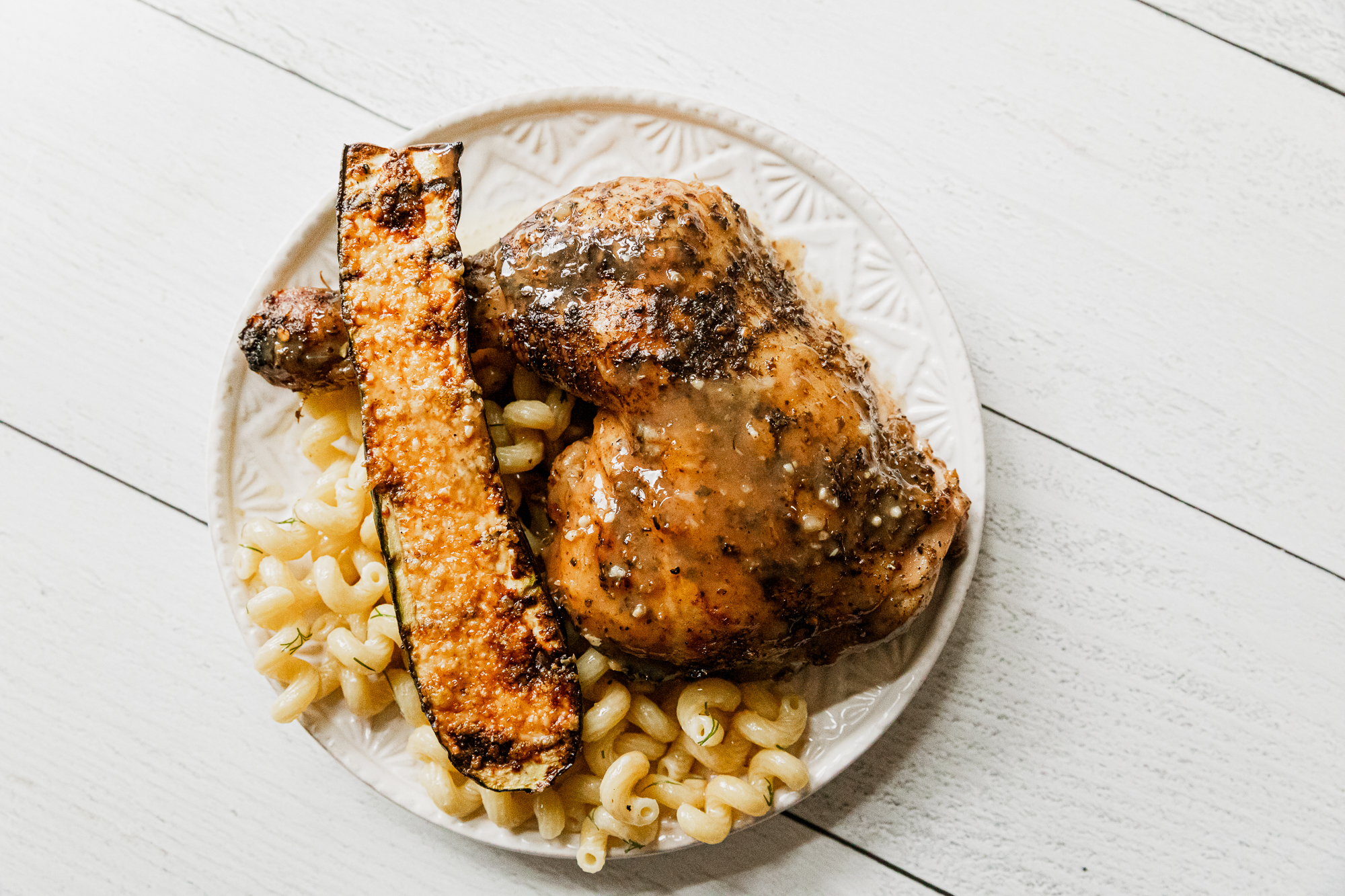 Traeger grilled zucchini topped with parmesan.