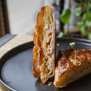 Crispy homemade ham and cheese hot pocket with flaky pastry crust.