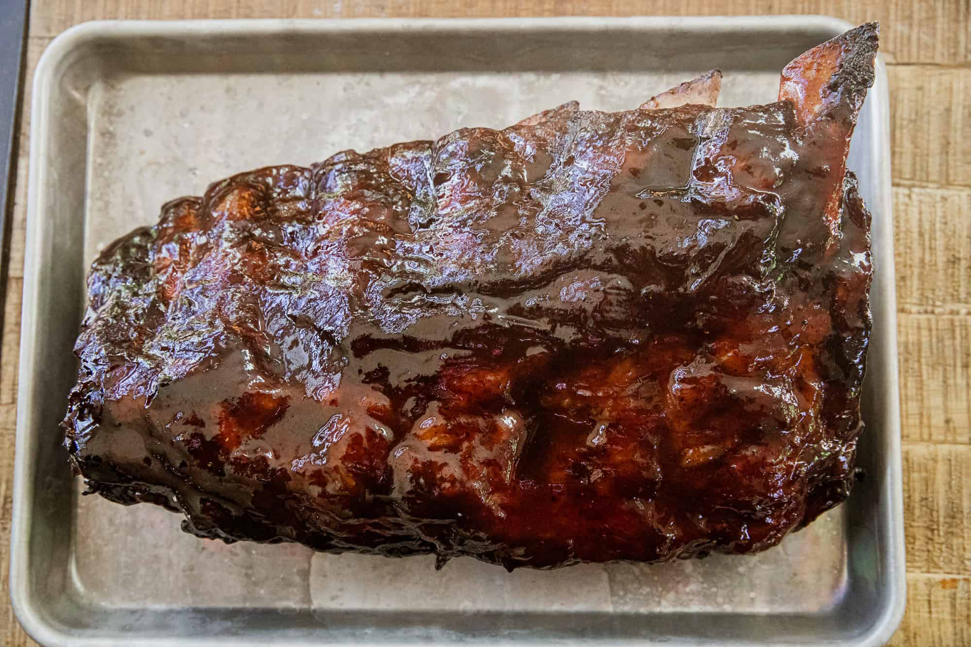 Delicious smoked prime rib bones with rich, smoky flavor and tender meat remnants. Perfect for flavo.