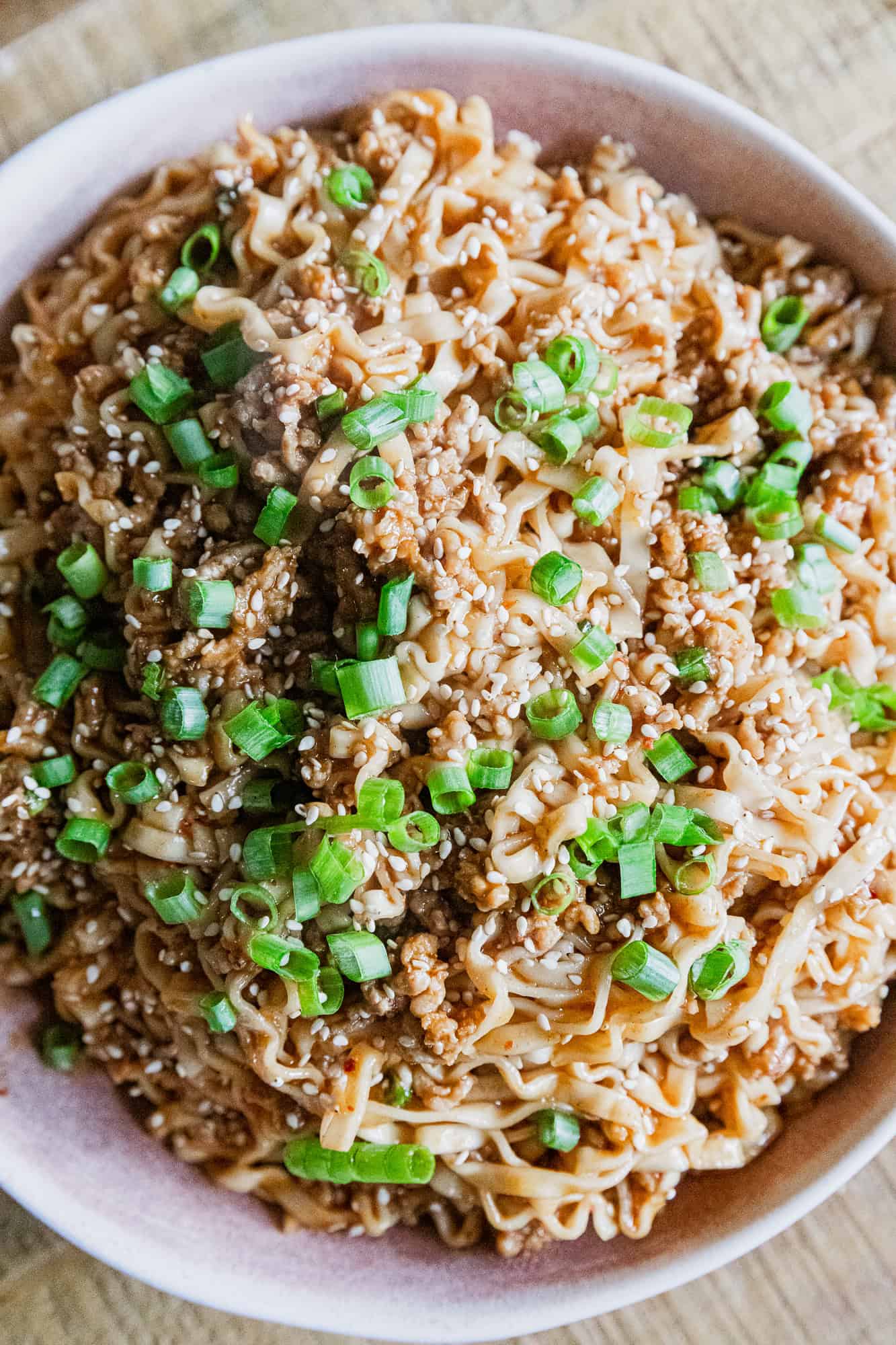 Soy scallion noodles with savory pork and fresh green onions. Perfect for a quick, flavorful Asian-i.