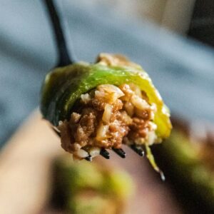 Stuffed Hatch chili pepper with savory meat and rice filling, ready to enjoy. Perfect for spicy appe.