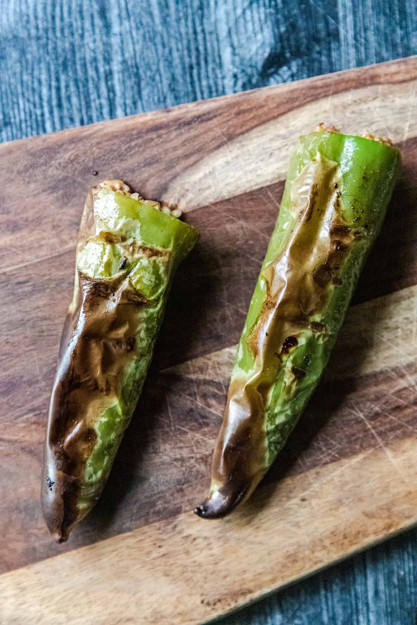 Grilled stuffed hatch chili peppers with melted cheese and smoky flavor.