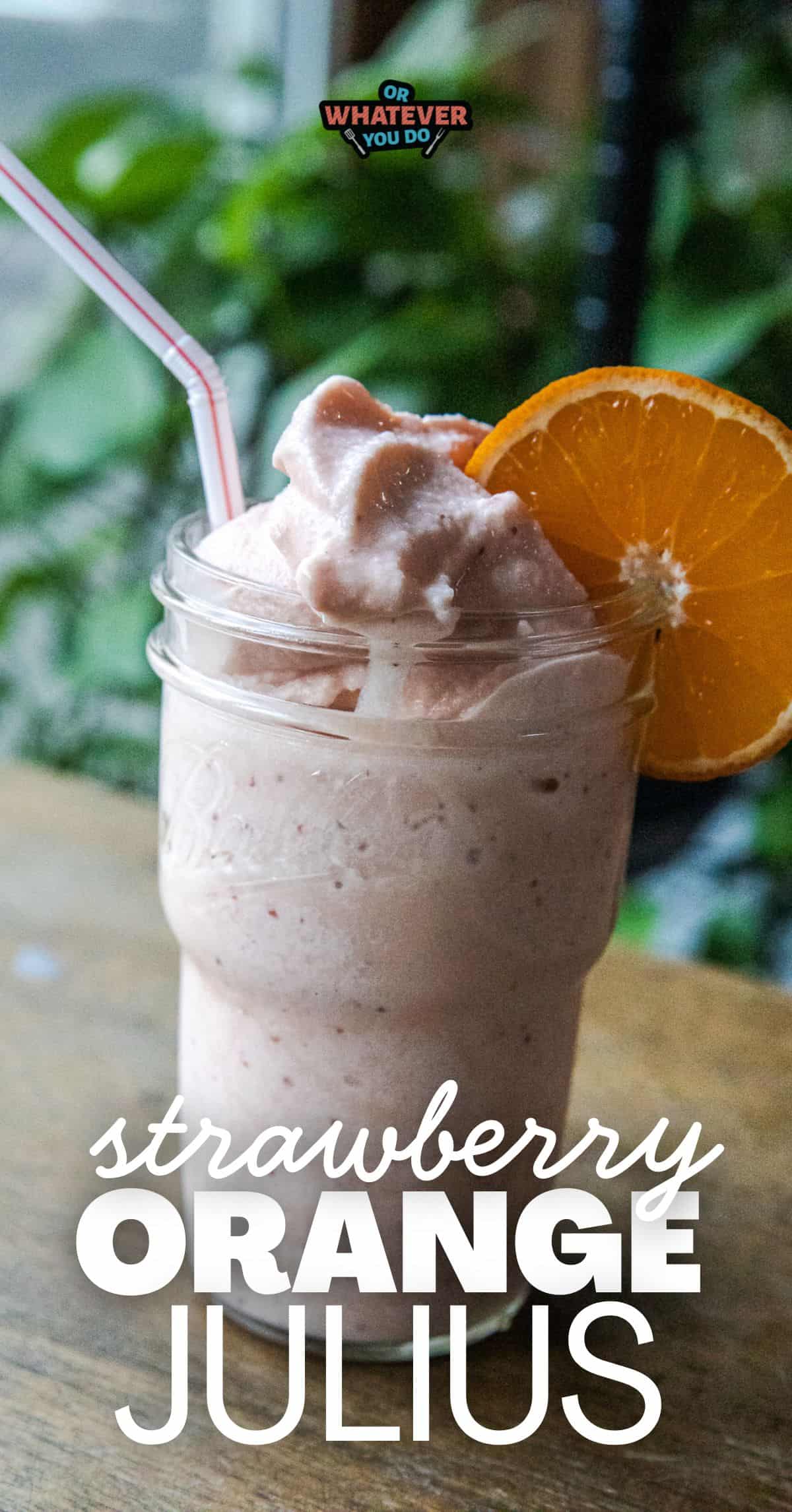 Refreshing strawberry orange Julius Ninja Slushi with whipped cream and orange slice.