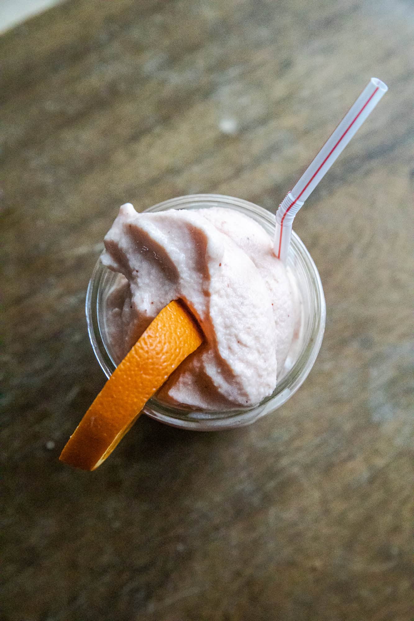 Delicious strawberry orange Julius ninja slushi with fresh fruit and creamy texture.