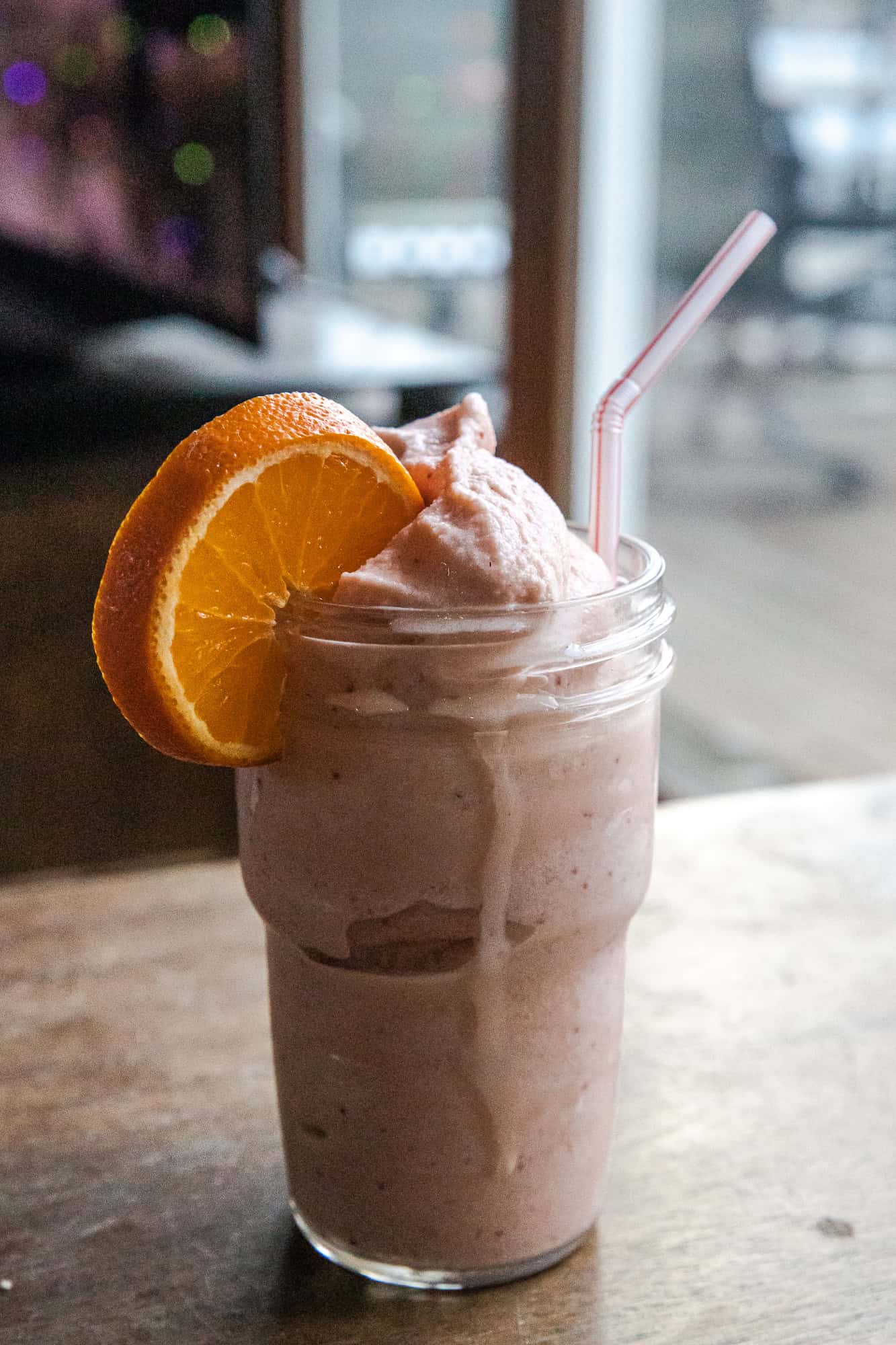 Delicious Strawberry Orange Julius Ninja Slushi with fresh fruit and creamy texture.