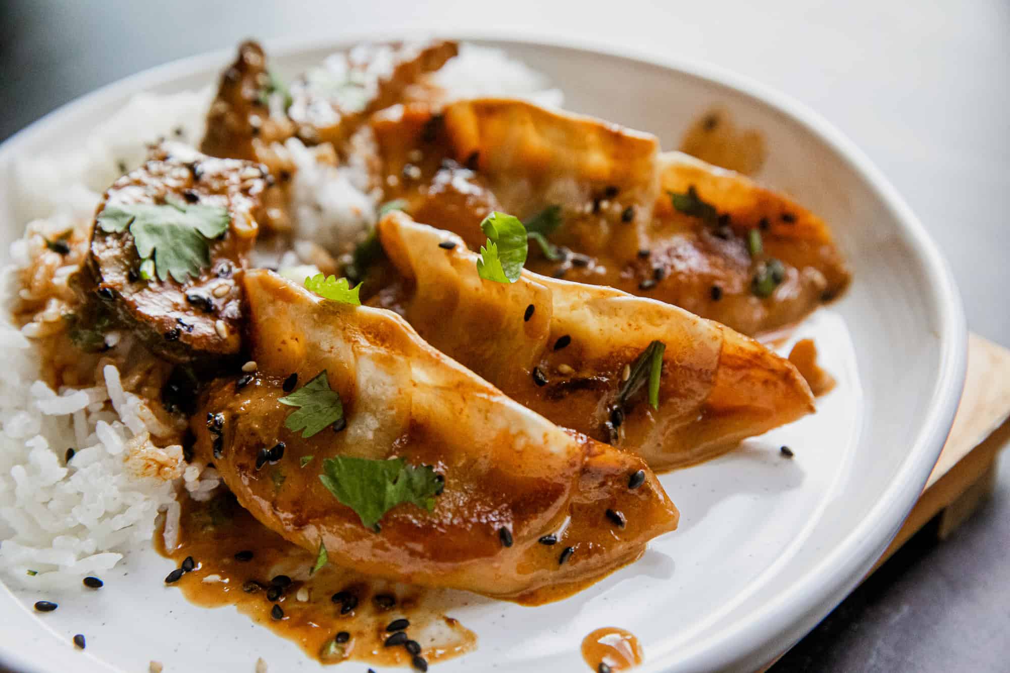 Delicious coconut curry dumplings with fresh herbs served over rice, perfect for flavorful, easy-to-.