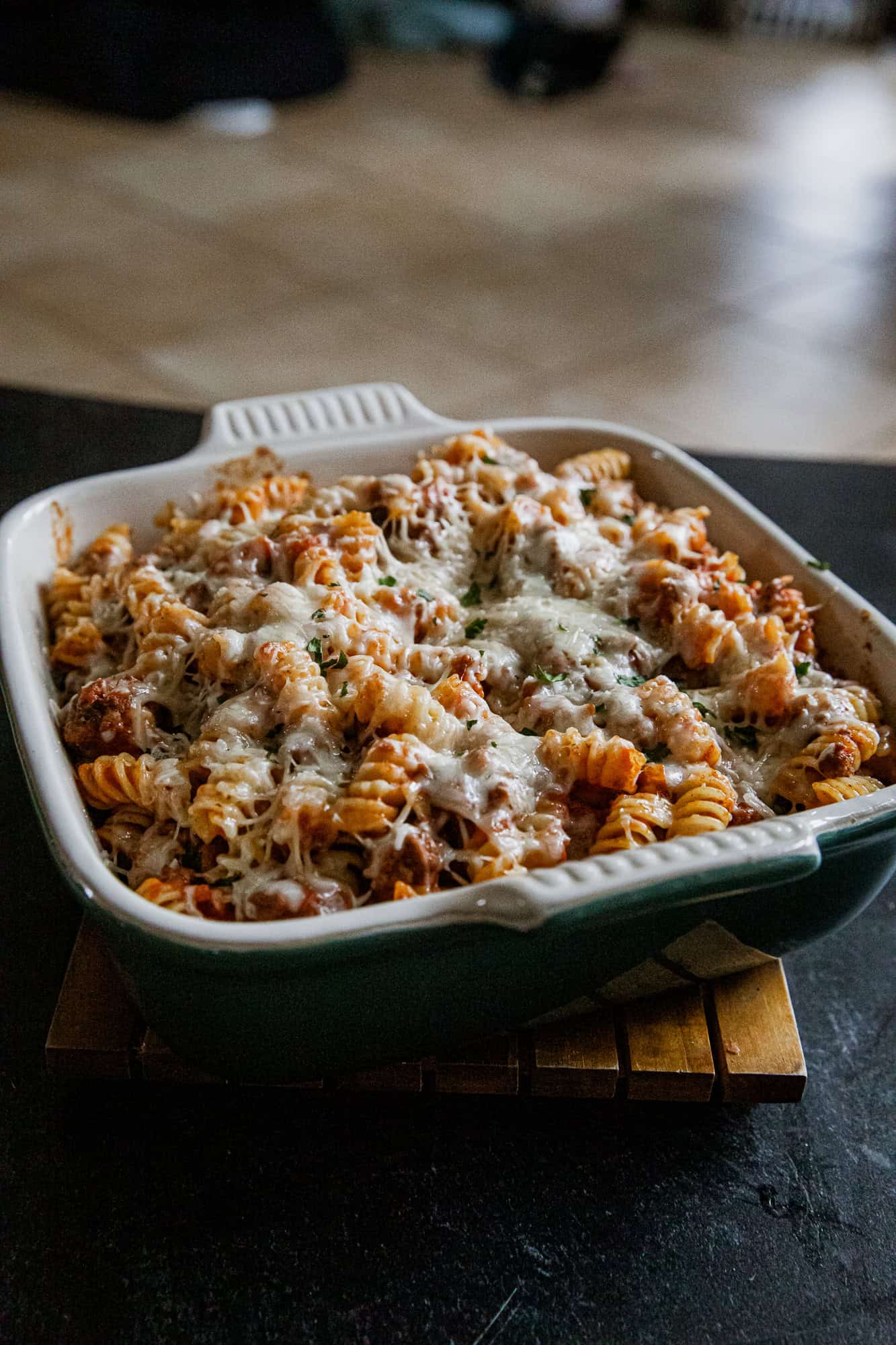 Cheesy Rotini Bake with melted cheese and pasta in a baking dish.