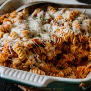 Delicious cheesy rotini pasta bake with melted cheese and savory sauce, perfect for a comforting mea.