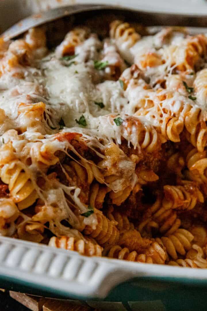 Delicious cheesy rotini pasta bake with melted cheese and savory sauce, perfect for a comforting mea.