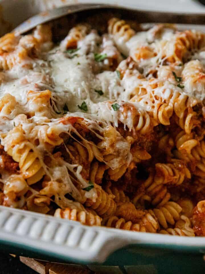 Delicious cheesy rotini pasta bake with melted cheese and savory sauce, perfect for a comforting mea.