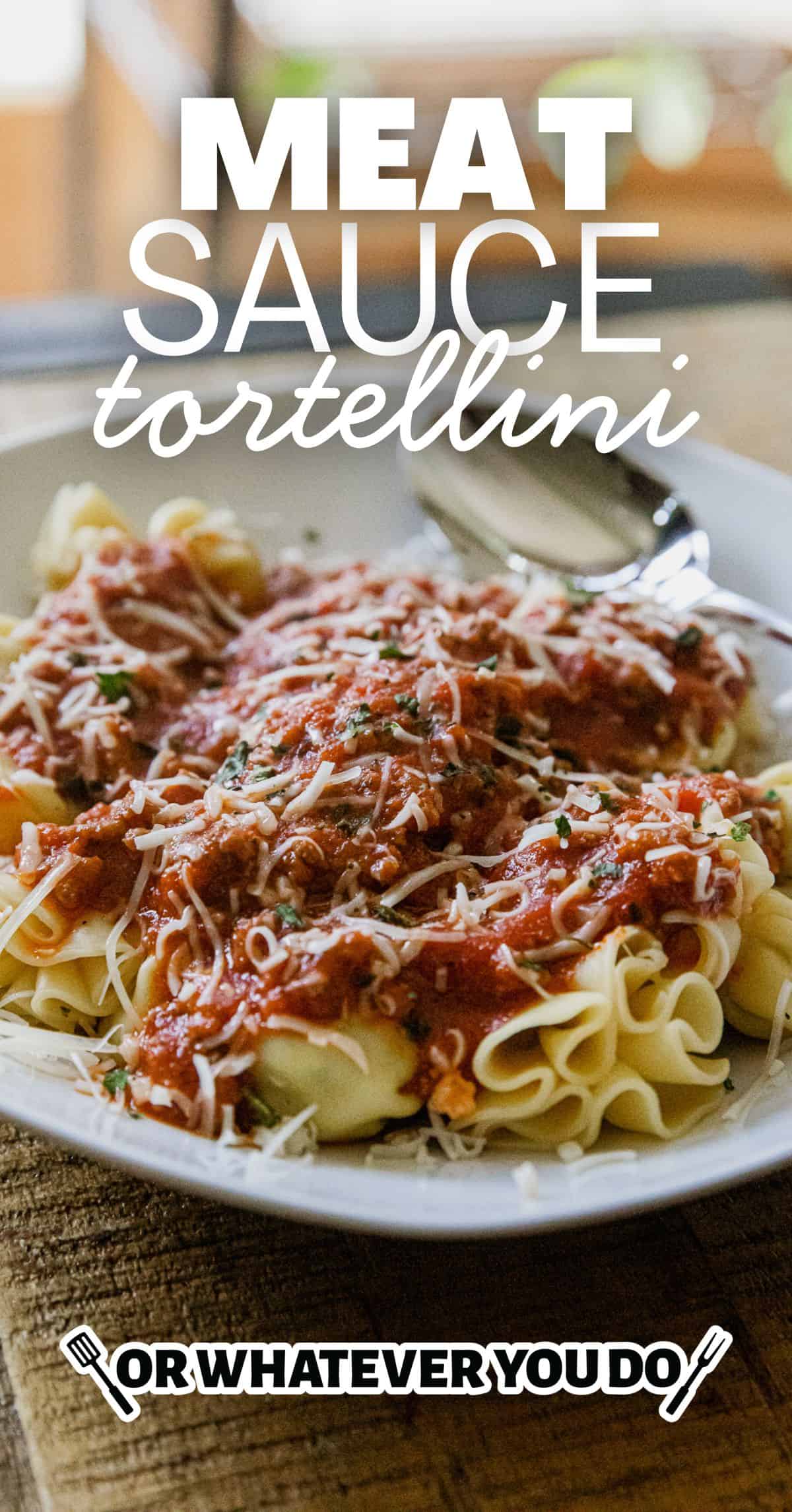 Delicious cheese tortellini topped with hearty meat sauce, perfect for a comforting Italian meal.