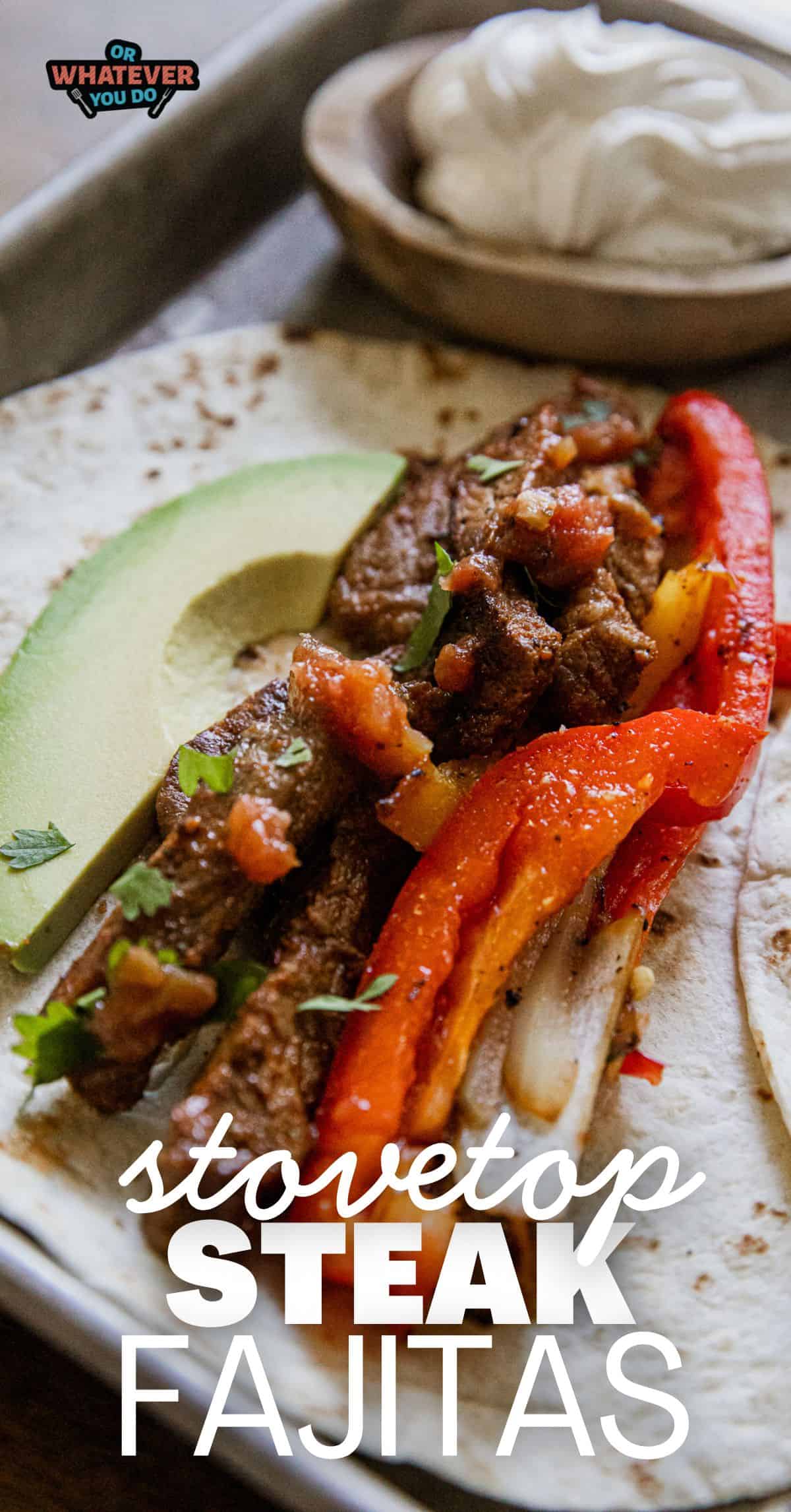 Delicious stovetop steak fajitas with peppers, onions, and avocado slices.