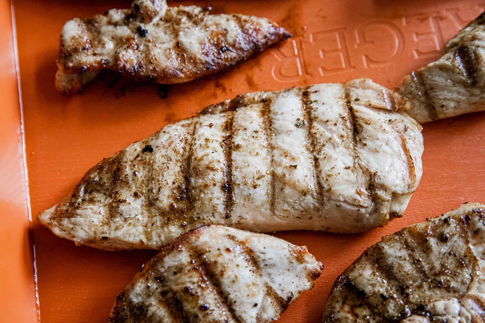 Juicy Traeger-grilled chicken breasts with grill marks, ready to serve.