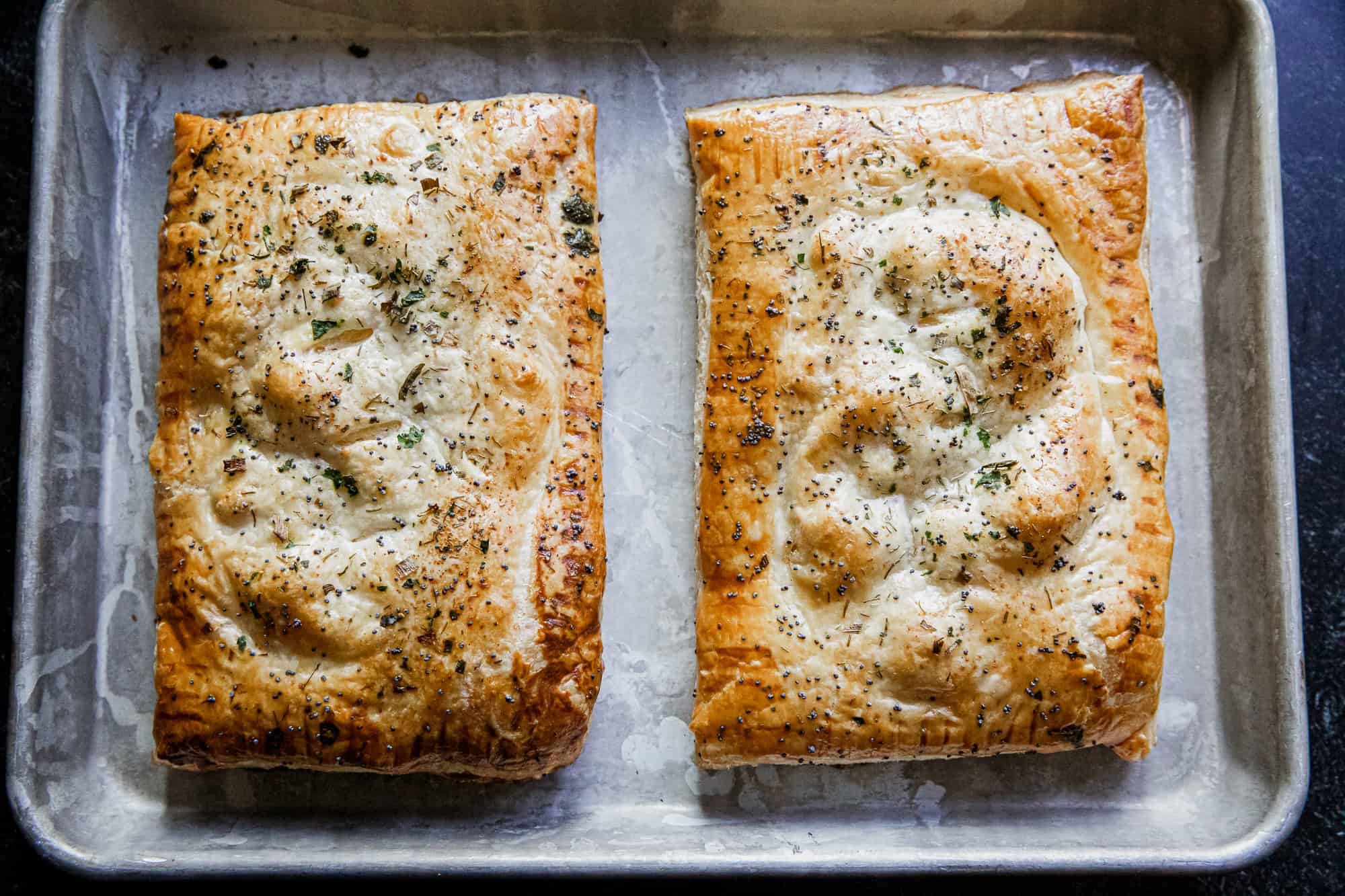 Baked Chicken Bacon Ranch Hot Pockets on a baking sheet.