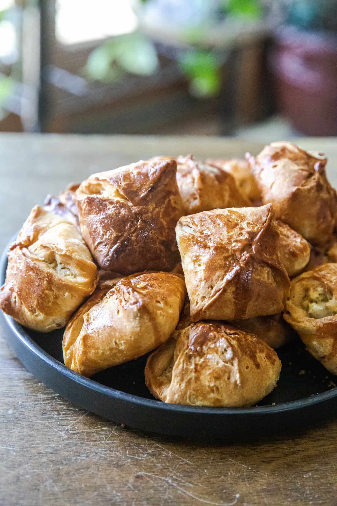 Delicious bite-sized biscuit snacks filled with cheesy artichoke dip, perfect for parties and gather.