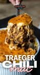 Close-up of a spoonful of hearty Traeger Chili Mac with melted cheese.