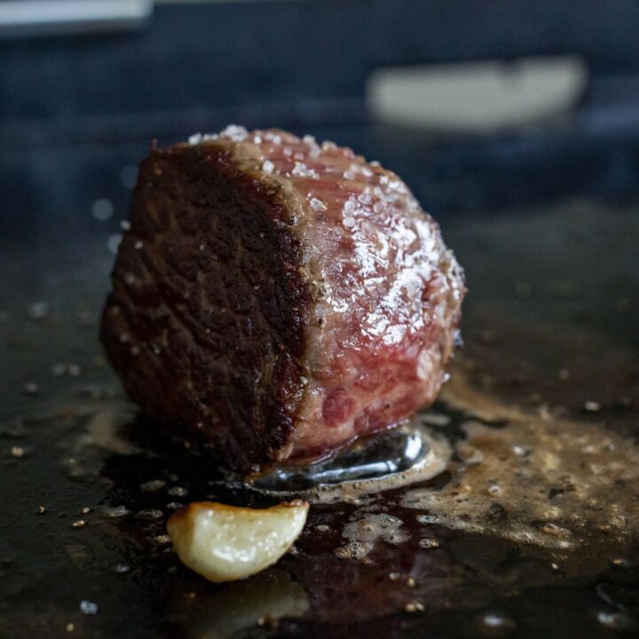 Blackstone grilled steak with a seared crust.