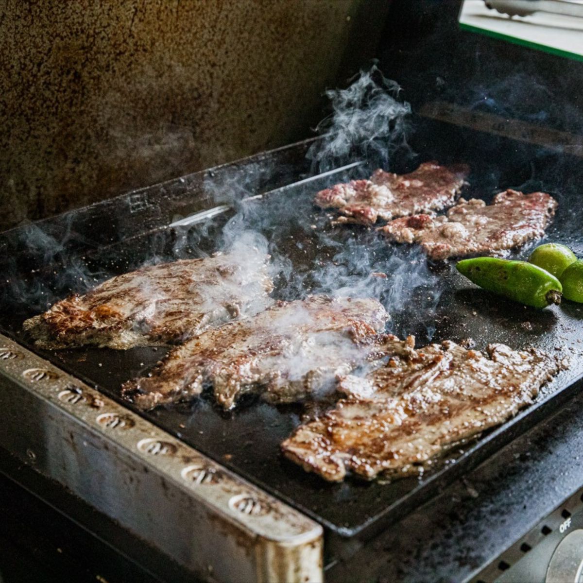 Easy Blackstone carne asada tacos with lime and cilantro.